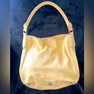 Light yellow Marc Jacobs bag, shoulder and cross body straps.